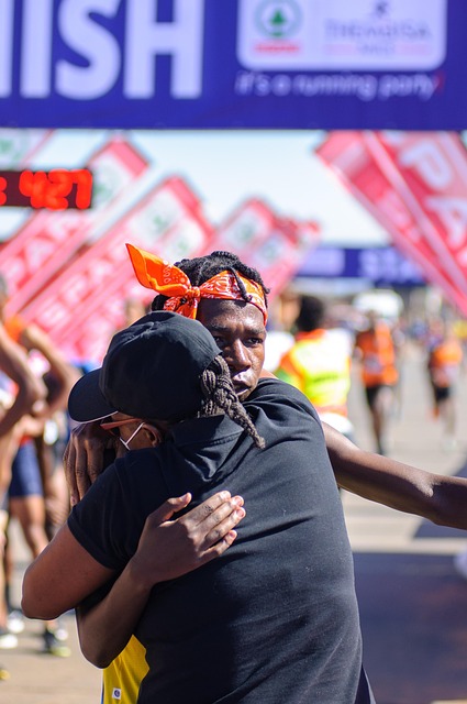Runners crossing the finish line together, highlighting teamwork and determination.